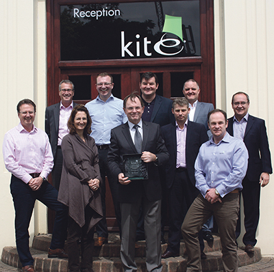 L-R: Paul Mustard, Neil Spears, Marie-Bernadette Ashe, Andy Fay, Bruce McInnes, Chris O’Reilly, Warren Powell, Jake Kirk, Gavin Ashe & Neil Hopkins of Kite Packaging accept the Outstanding Achievement Award